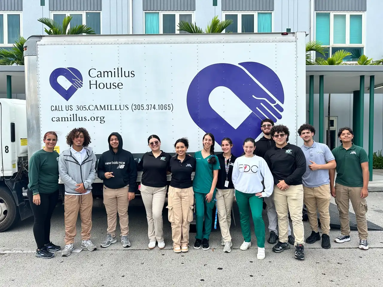 Our team aiding the Camillus House Kid's Clothing Donation Drive